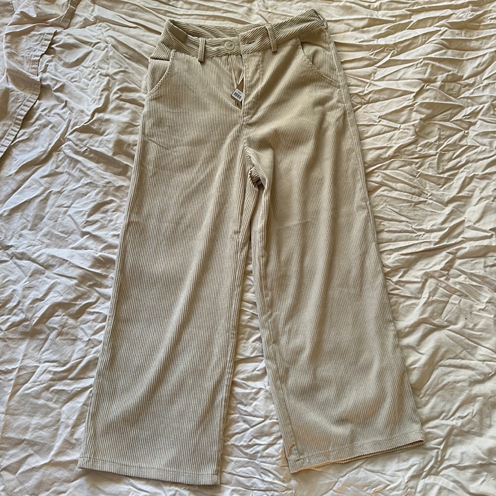 Miss Love size small cream corduroy high waisted, wide legged, ankle fit pants.